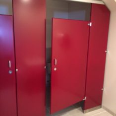 Thumbnail of http://Bright%20red%20bathroom%20stalls