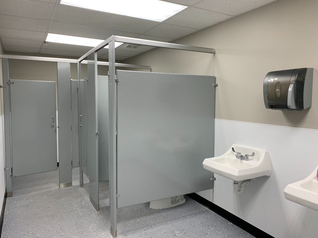 Light blue restroom partition installation and design