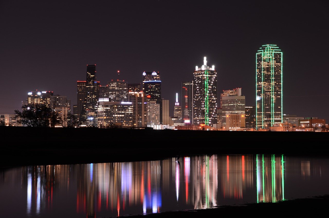 Dallas Texas city skyline from water at night